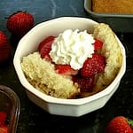 Shortcake topped with strawberries and whipped cream