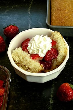 Shortcake topped with strawberries and whipped cream