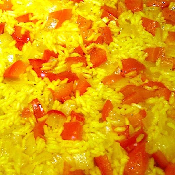rice, onion and bell pepper simmering