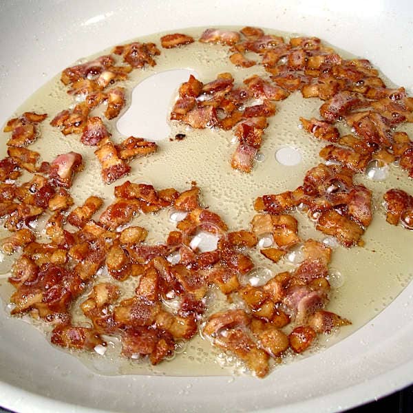 Bacon browning in a skillet