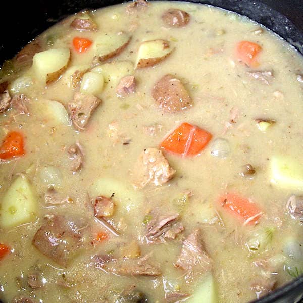A finished pot of Normandy-style pork stew