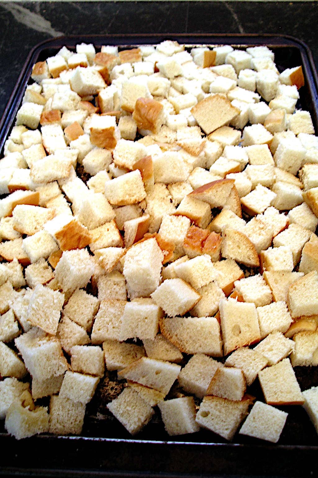 bread cubes laid out to stale slightly